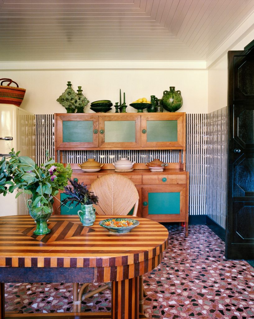 Inside Flamingo Estate, kitchen cabinets, dining table