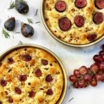 Baked focaccia with red grapes, fig, goat cheese, rosemary and honey