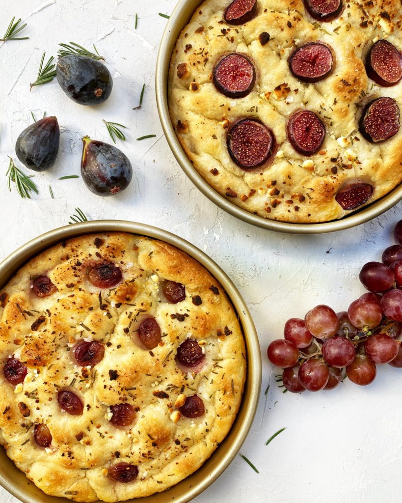 Baked focaccia with red grapes, fig, goat cheese, rosemary and honey