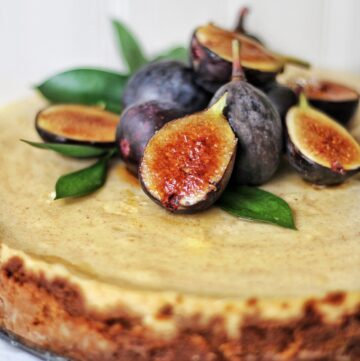 Cinnamon Mascarpone Cheesecake with Brûléed Figs with slice on plate
