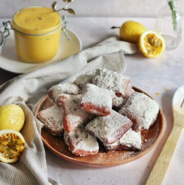 Plate of beignets with powdered sugar