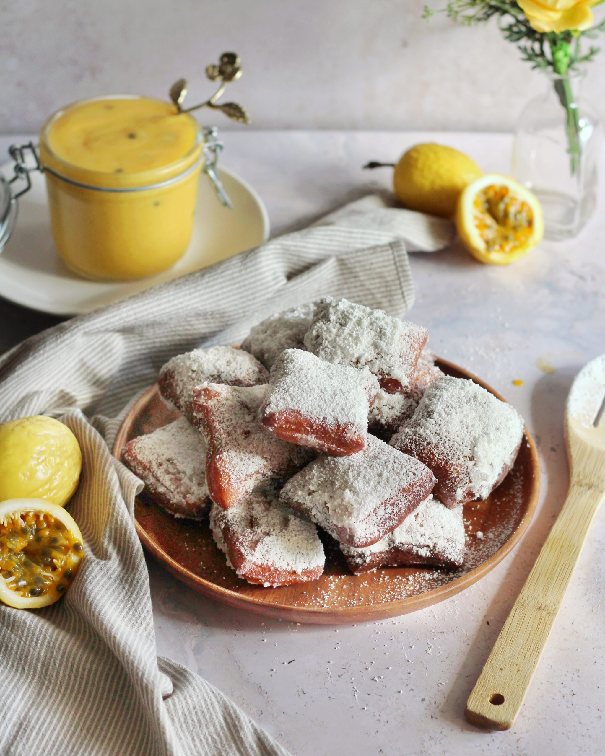 Plate of beignets with powdered sugar