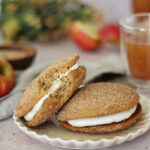 Apple cider donut whoopie pies on a plate