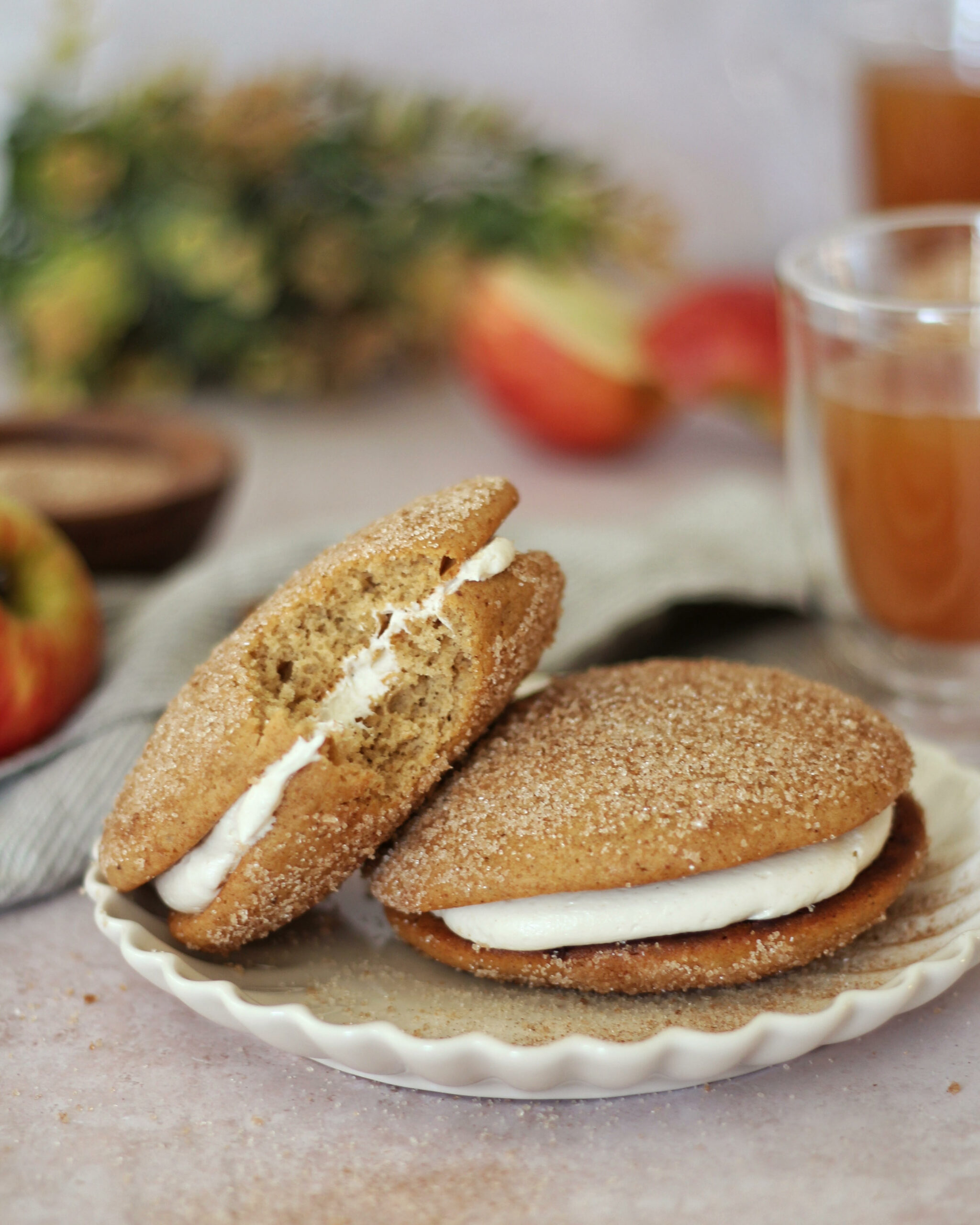 Apple cider donut whoopie pies on a plate